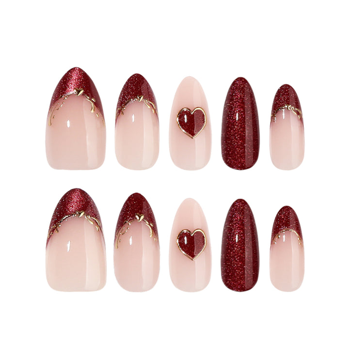Artful stiletto nails with heart designs and glitter embellishment Kalsten