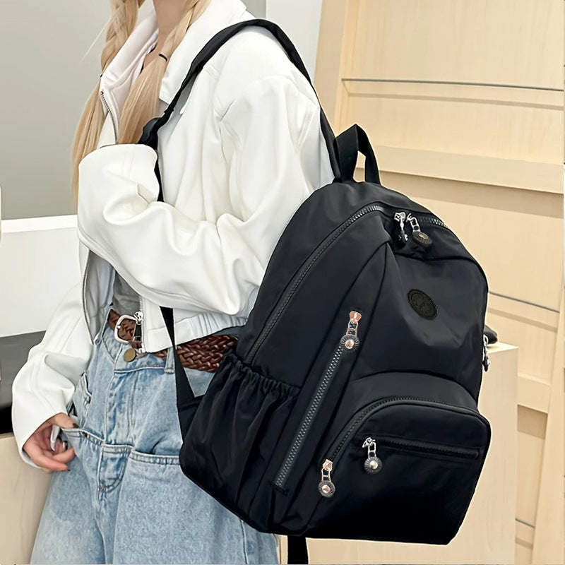 Multi-Pocket Travel Backpack with Water-Resistant Material Kalsten
