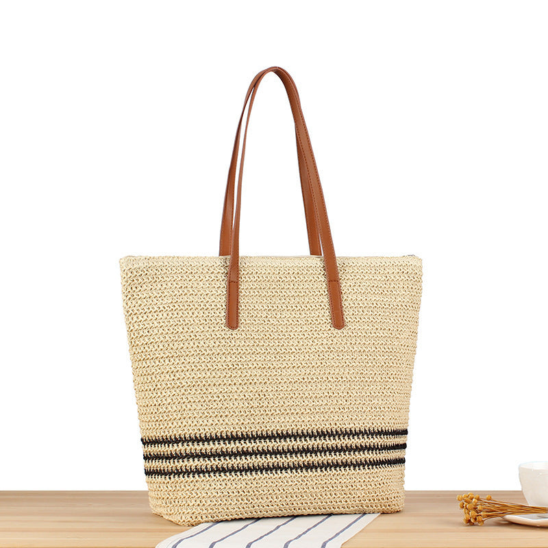 Stylish beach bag made of natural weave with leather handles Kalsten