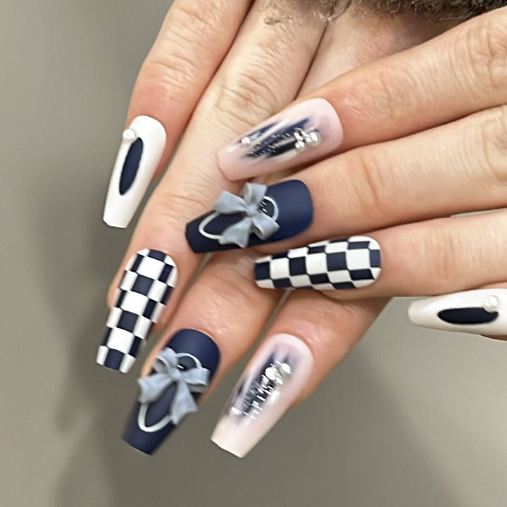 Artful nail decoration with bows and plaid pattern Kalsten
