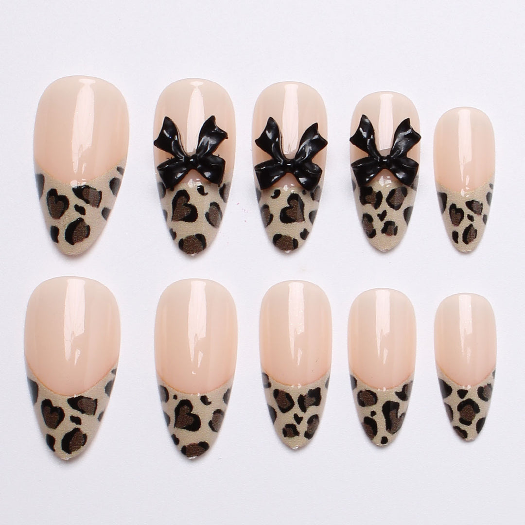 Creative artificial nails with stylish leopard pattern and bow accents Kalsten