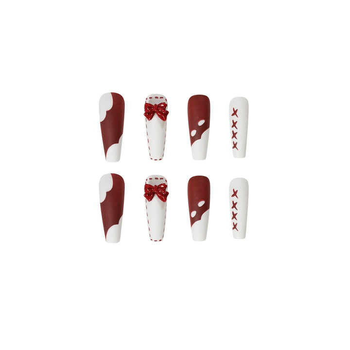 Artful stiletto nails with bow and zigzag design Kalsten