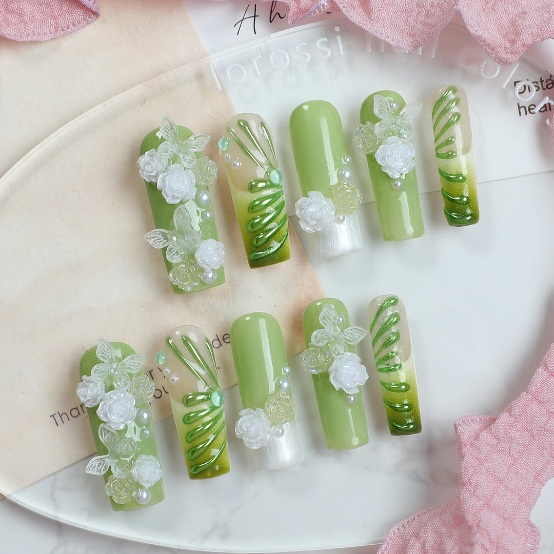 Creative nail set with floral design and delicate accents Kalsten