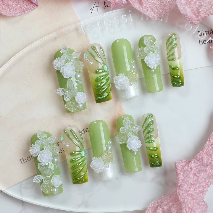 Creative nail set with floral design and delicate accents Kalsten