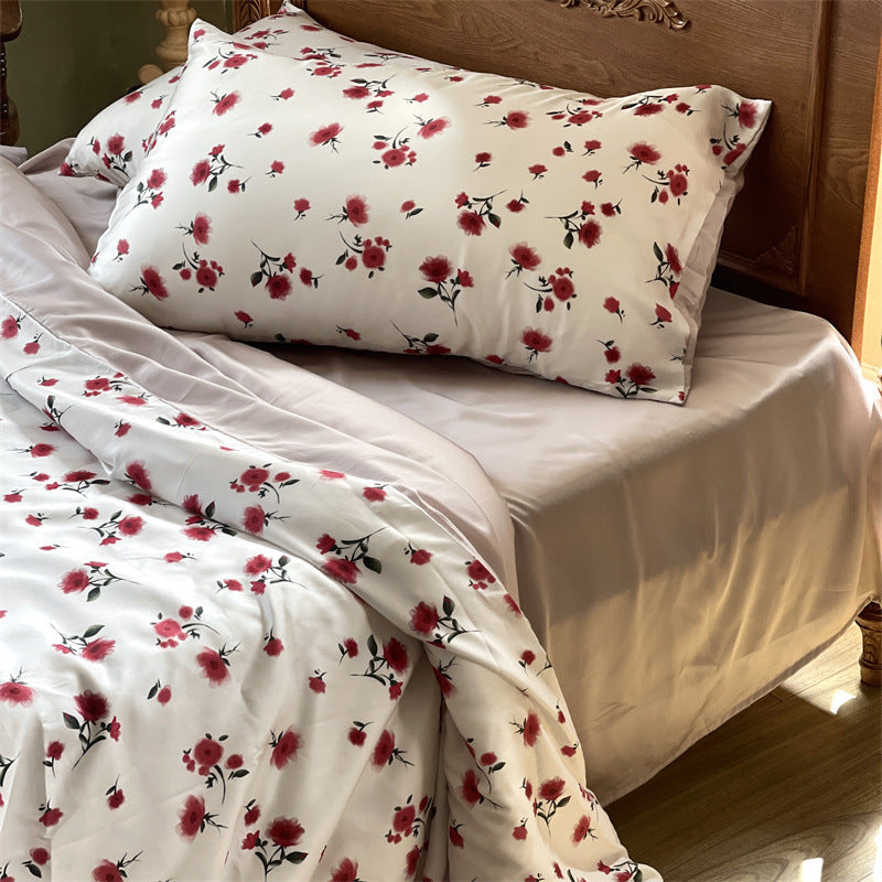 Satin bedding set with floral print and ruffle