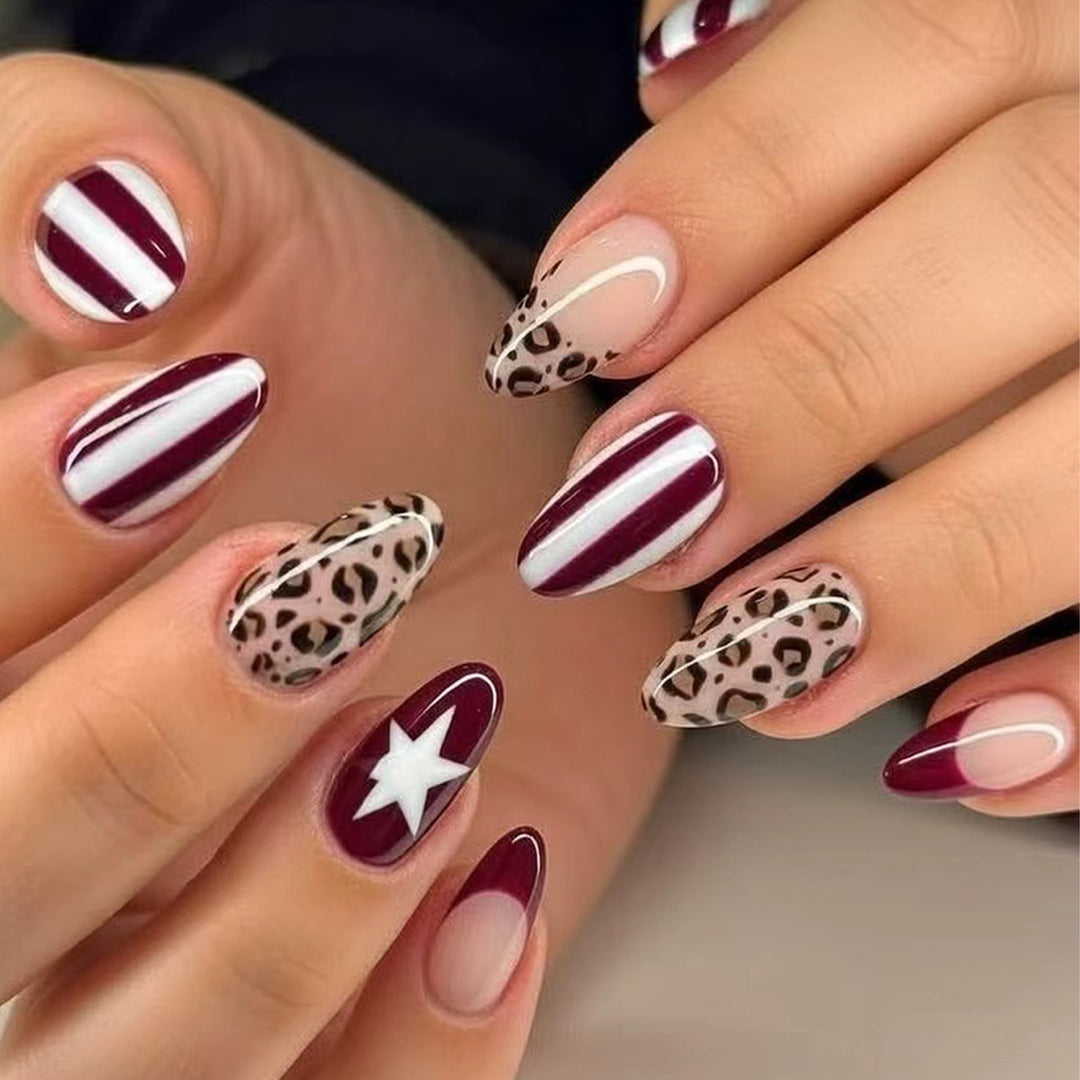 Artful stiletto nails with leopard pattern and elegant glitter decoration Kalsten
