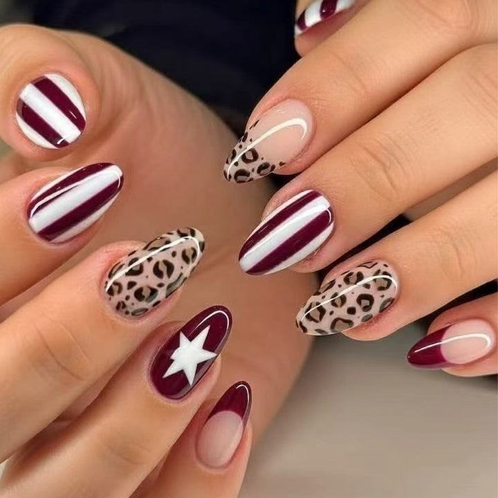 Artful stiletto nails with leopard pattern and elegant glitter decoration Kalsten