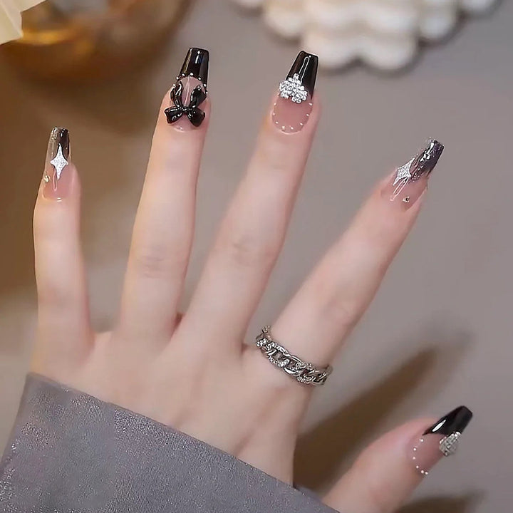 Acrylic nail set with glamorous 3D decorations and noble accents Kalsten