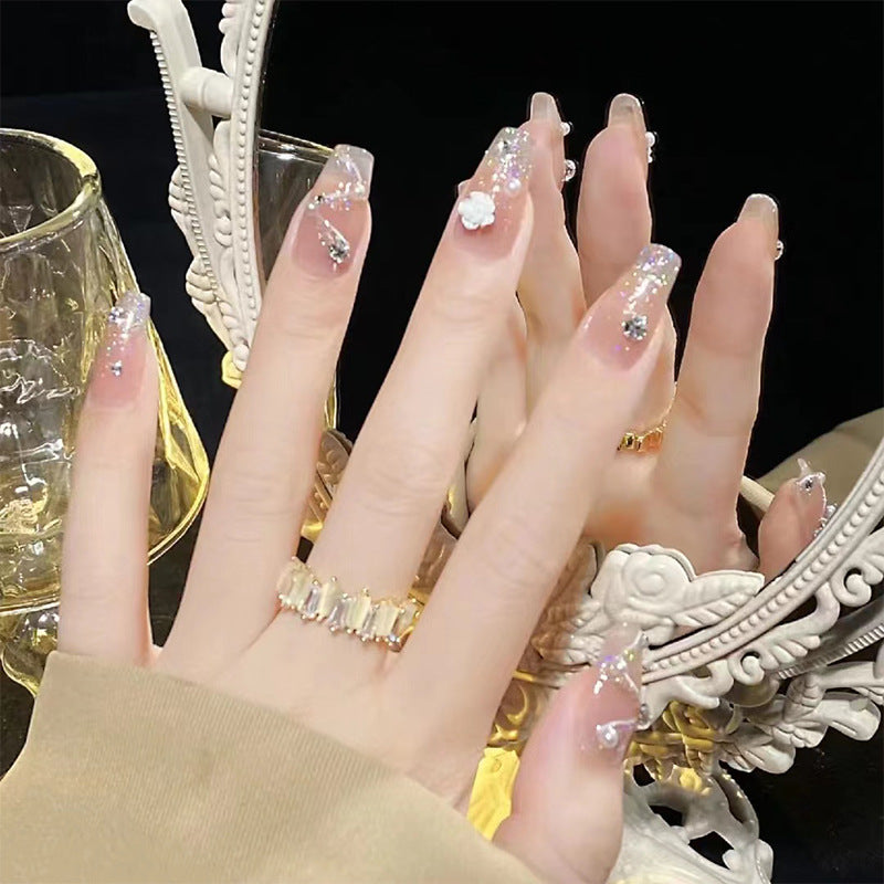 Glamorous artificial nails with heart design and glittering accents Kalsten