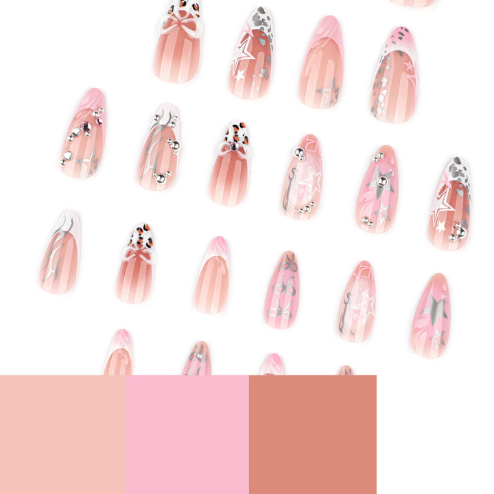 Artful stiletto nails with glitter and bow decorations Kalsten