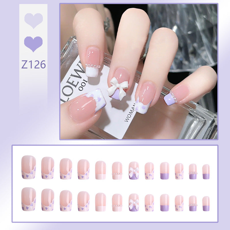 Nail art set with elegant wave patterns and delicate pearl accents Kalsten