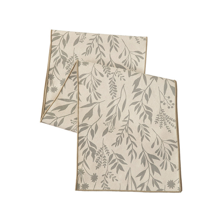 Woven table runner in botanical leaf pattern made of cotton blend Kalsten