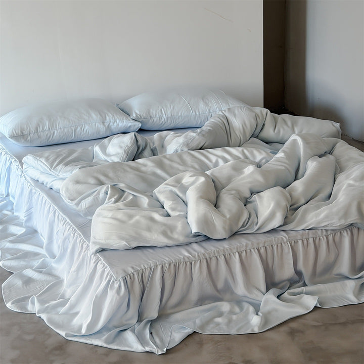 Bedding set with voluminous bed skirt and soft satin finish
