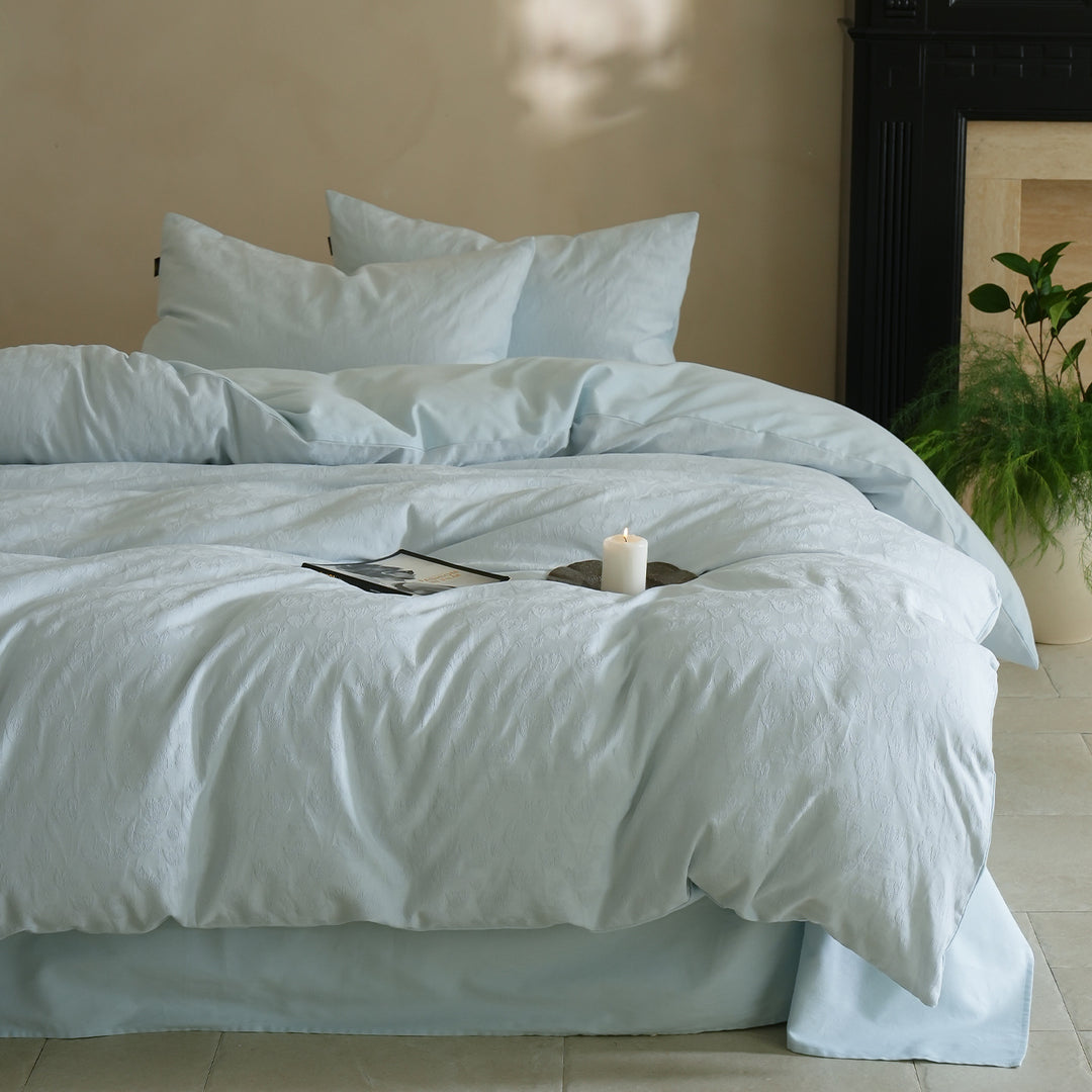 Fine woven bedding set made of cotton satin with subtle jacquard flower texture