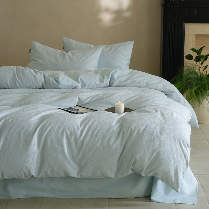 Fine woven bedding set made of cotton satin with subtle jacquard flower texture