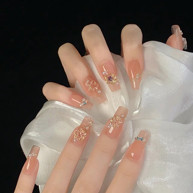 Glamorous artificial nails with moon and star motifs Kalsten
