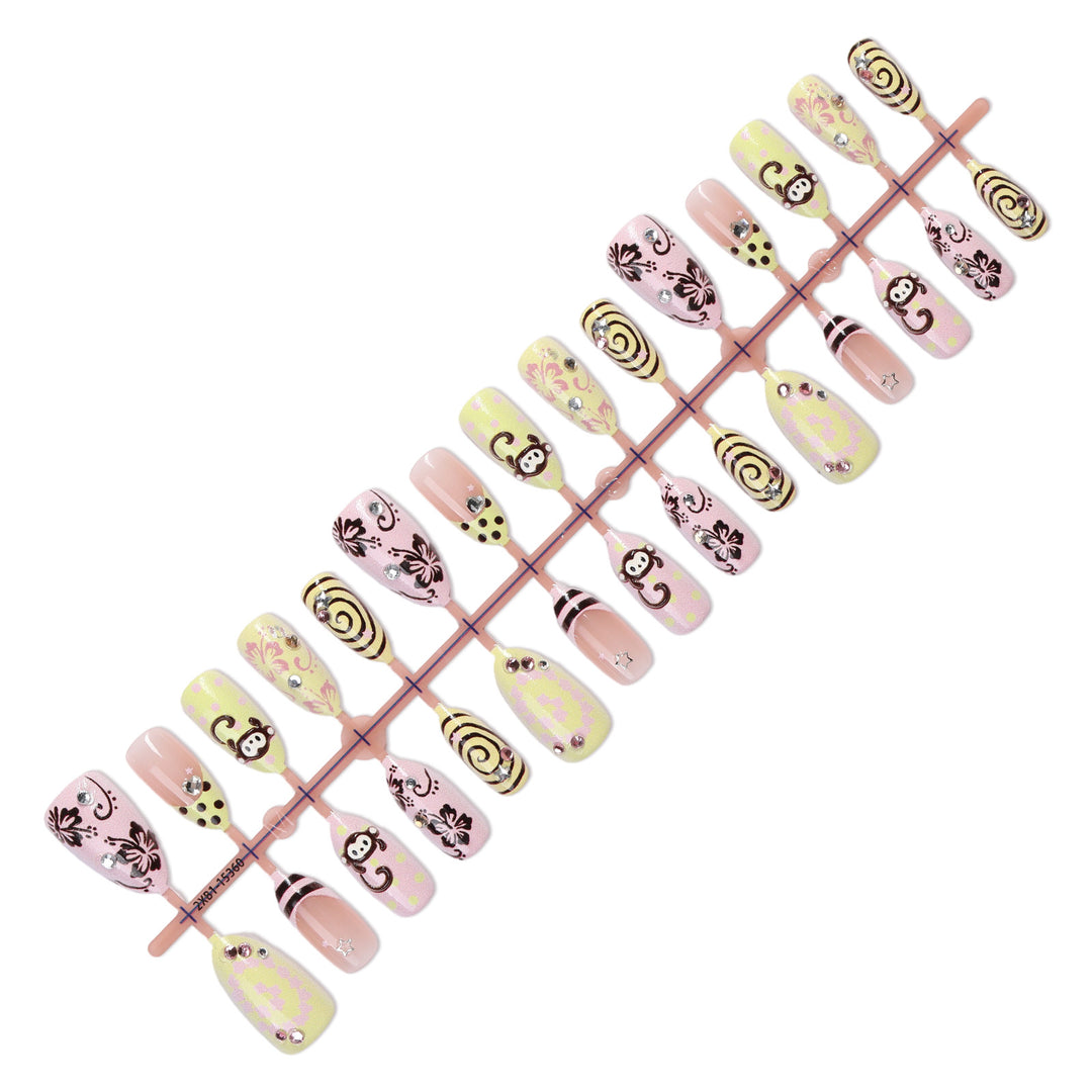 Creative nail art set with playful monkey designs and glitter details Kalsten