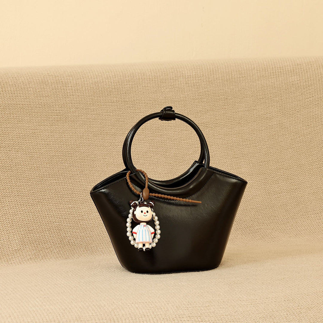 Chic Structured Handbag with Decorative Charm