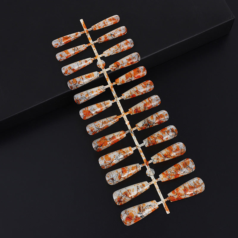 Creative nail art with blood splatter design Kalsten