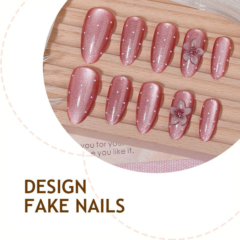 Artificial nail set with glamorous glitter design and floral accent Kalsten