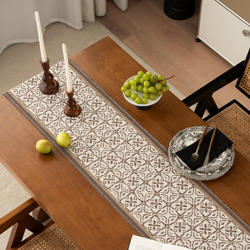 Decorative table runner with woven ornament jacquard and finely hemmed edges Kalsten