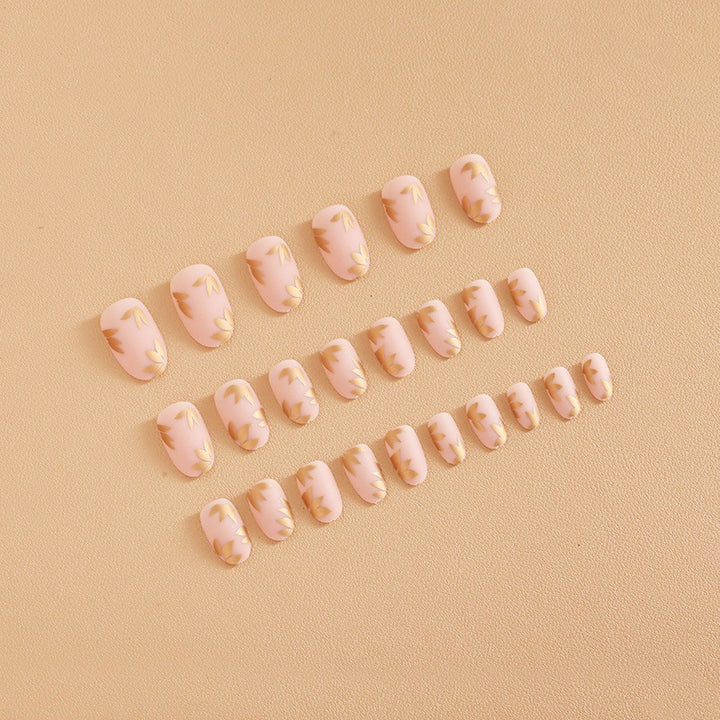 Artificial nail set with elegant gold leaf design Kalsten