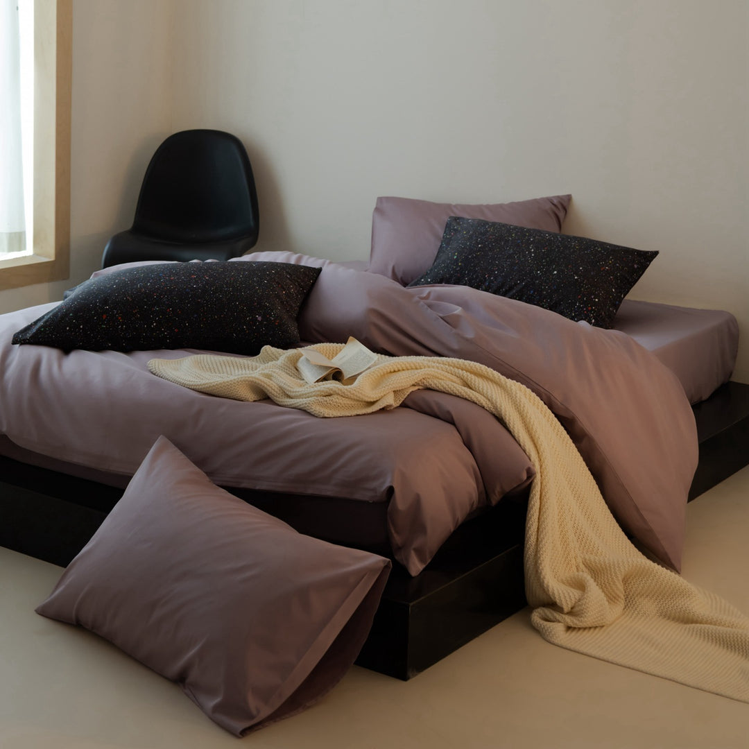 Luxurious cotton satin bedding set with contrasting patterned pillows