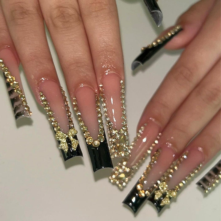 Acrylic nail set with glamorous 3D bows and radiant rhinestone decorations Kalsten