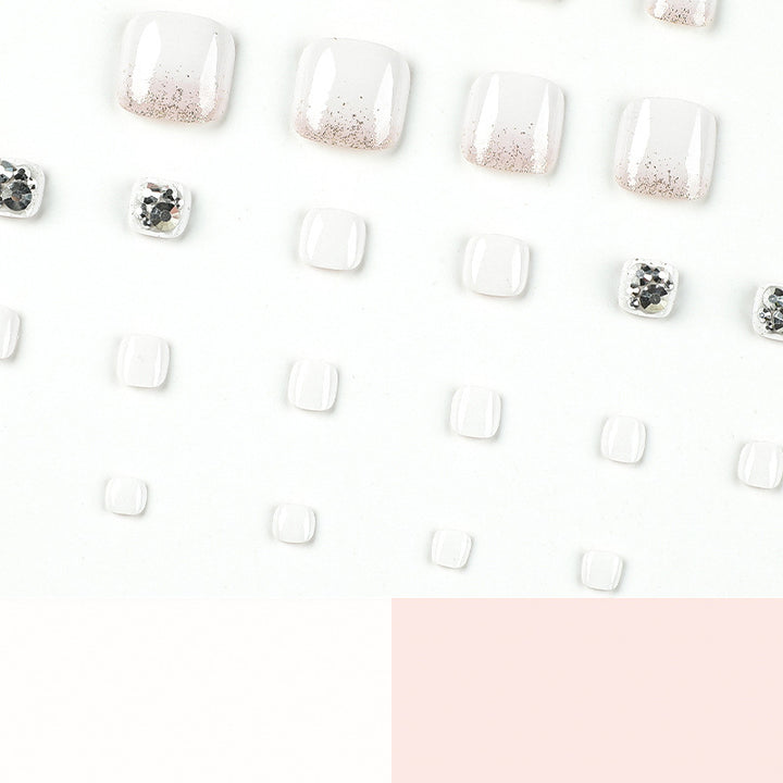 Artful toenail design with sparkling embellishments Kalsten