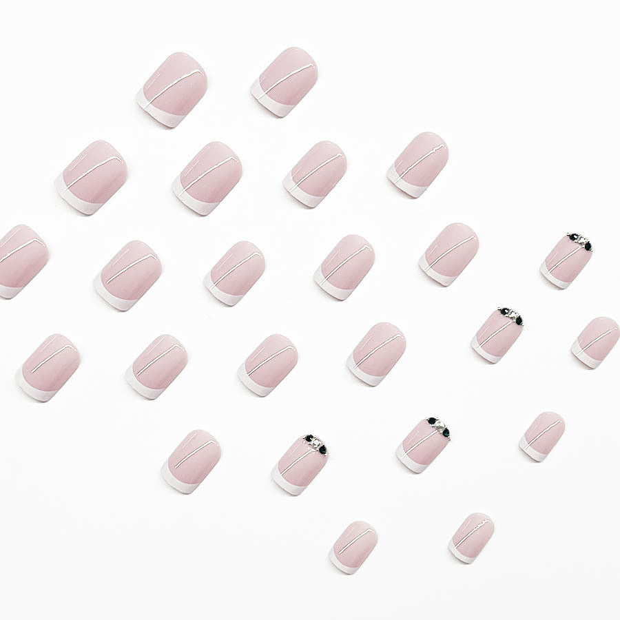 Art nail set with elegant French design and glittering accents Kalsten