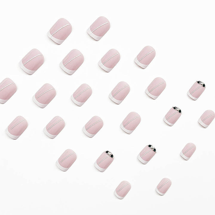 Art nail set with elegant French design and glittering accents Kalsten