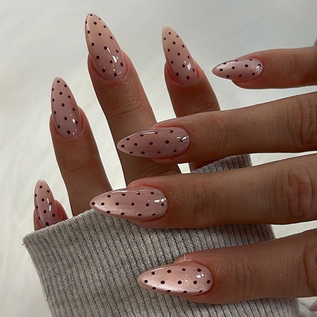 Artful stiletto nails with elegant floral design and glitter details Kalsten