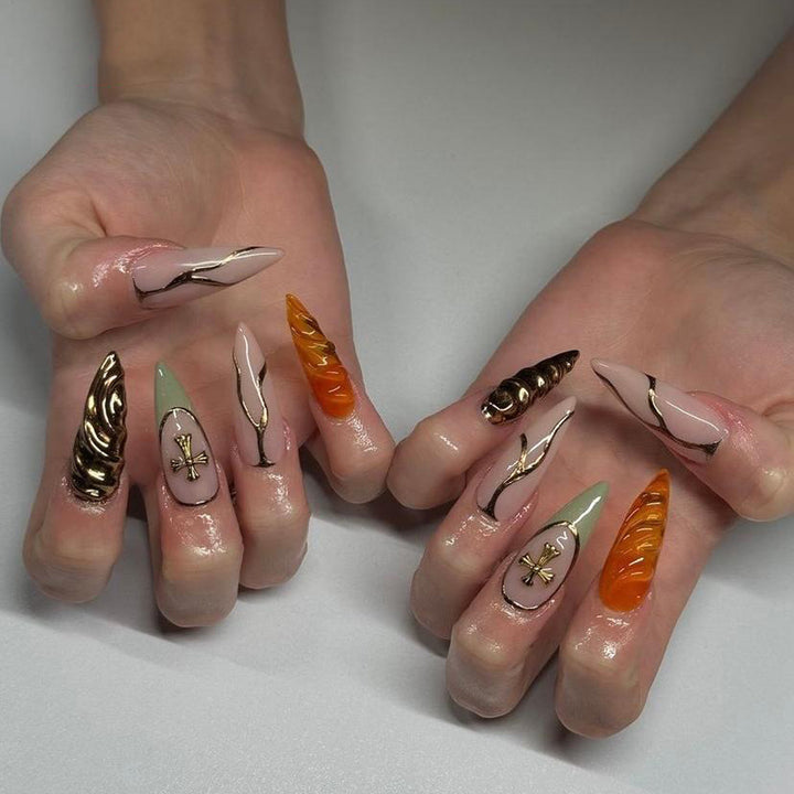 Artful stiletto nails with glitter and motif decorations Kalsten
