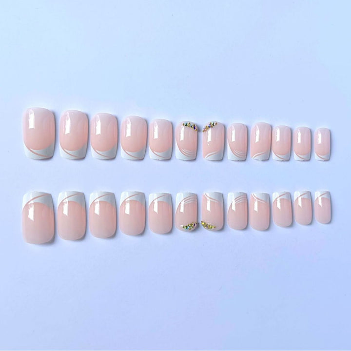 Elegant French Tip Press-On Nails with Gem Accents