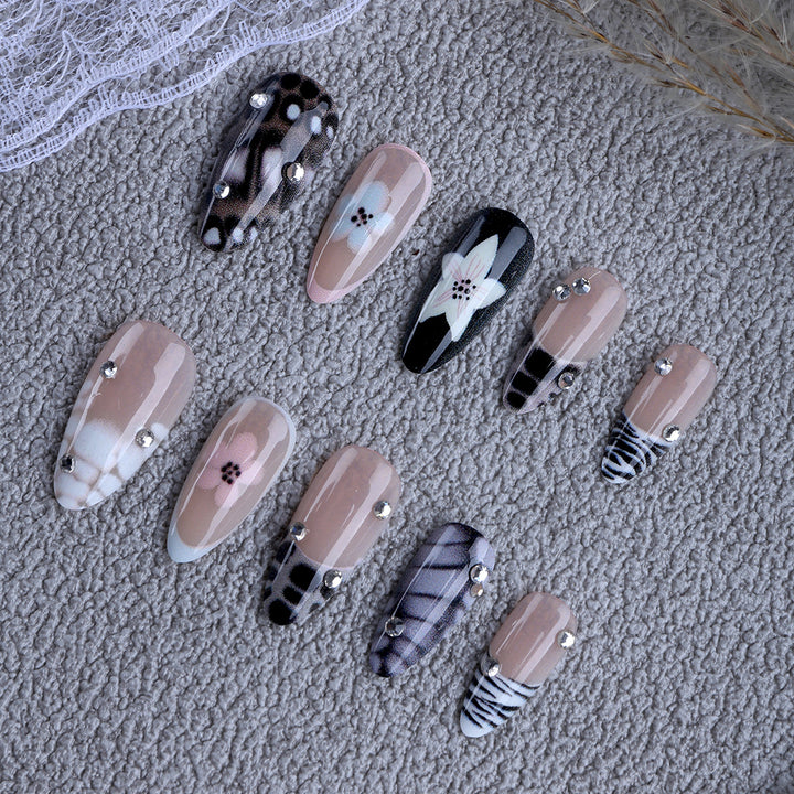 Nail art with elegant designs and embellishments Kalsten