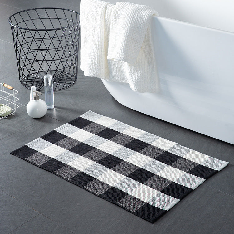 Striped cotton doormat with non-slip bottom and decorative woven edge Kalsten
