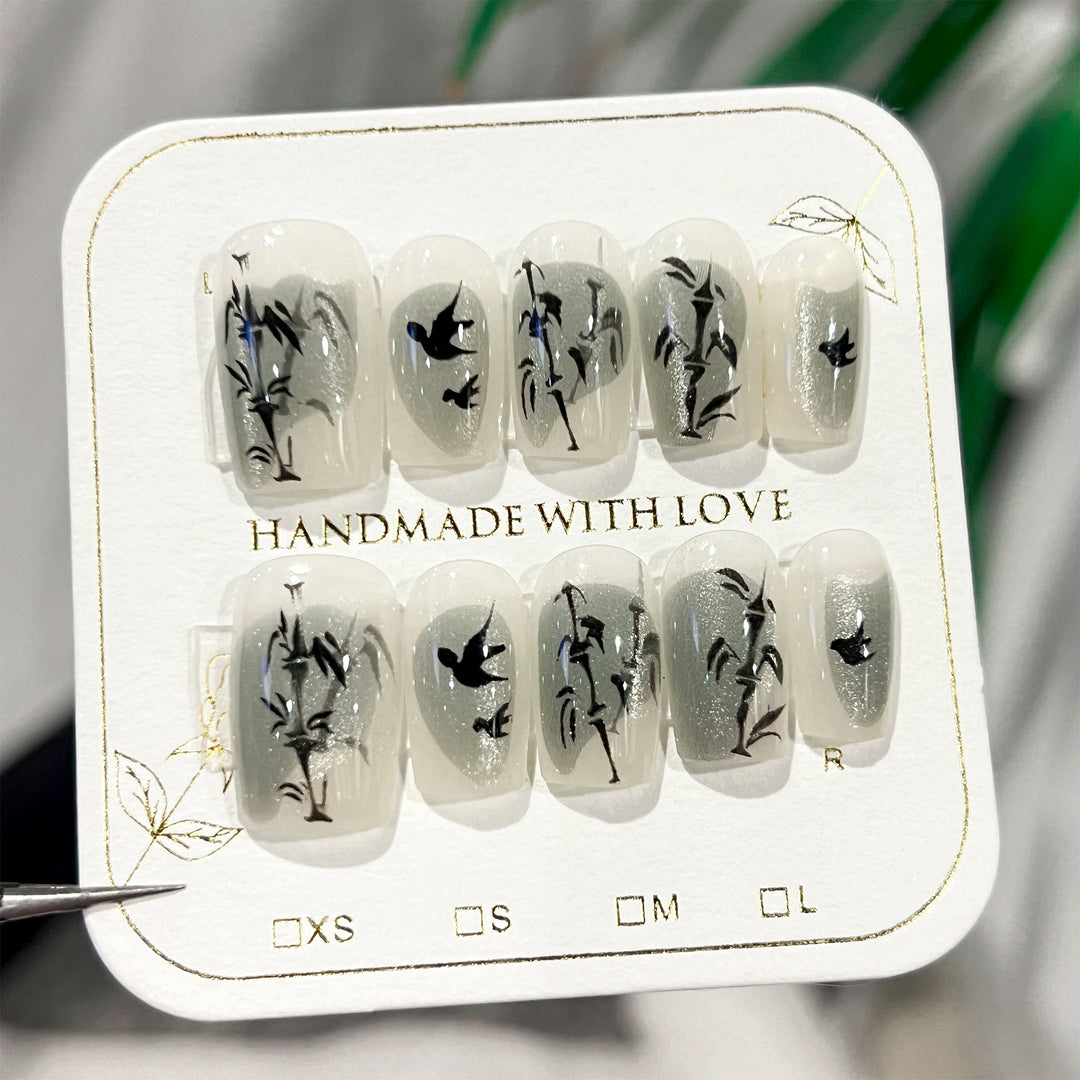 Handcrafted acrylic nails with decorative bird motifs Kalsten