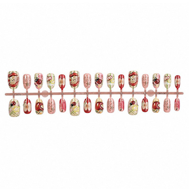 Creative nail art set with playful designs and glitter accents Kalsten