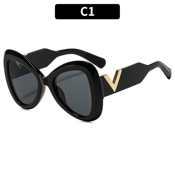 Elegant Cat-Eye Sunglasses with Decorative Temple Design