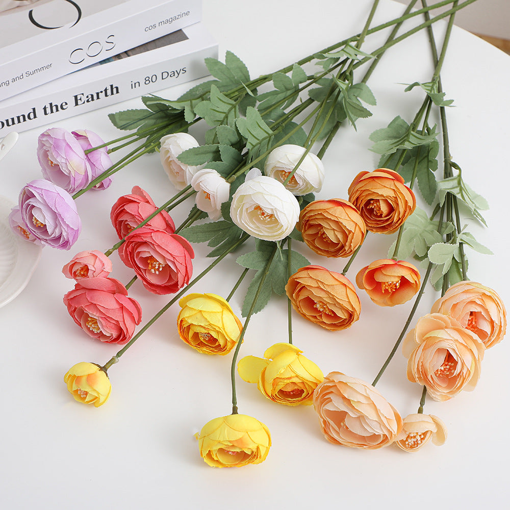 Decorative artificial flower bouquet with intricately detailed ranunculus