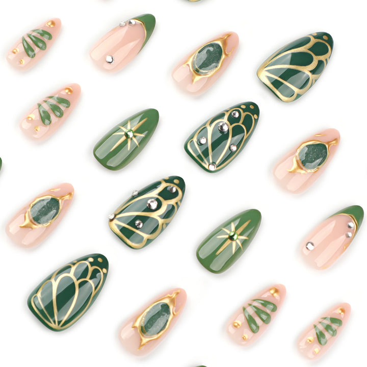 Artistic nail extensions with elegant gold and green shimmer Kalsten