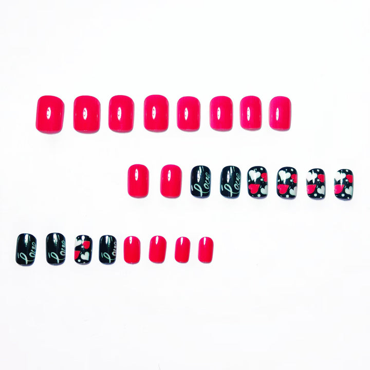 Acrylic nail design with hearts and kiss motifs Kalsten