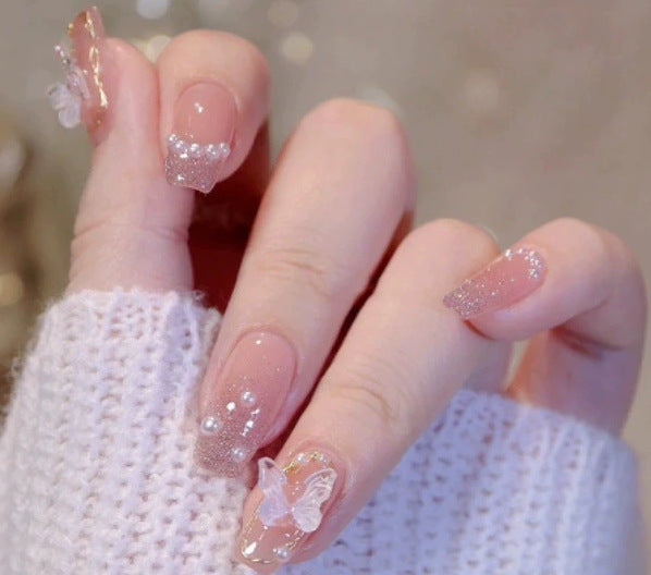 Elegant nail design with pearl embellishment Kalsten
