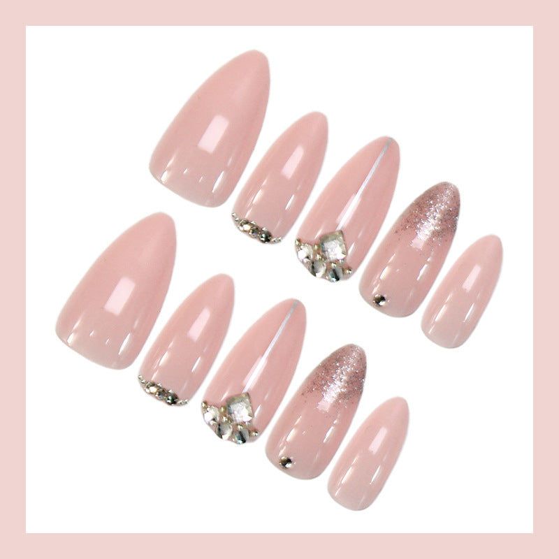 Glamorous artificial nails with rhinestone accents and shimmering effects Kalsten