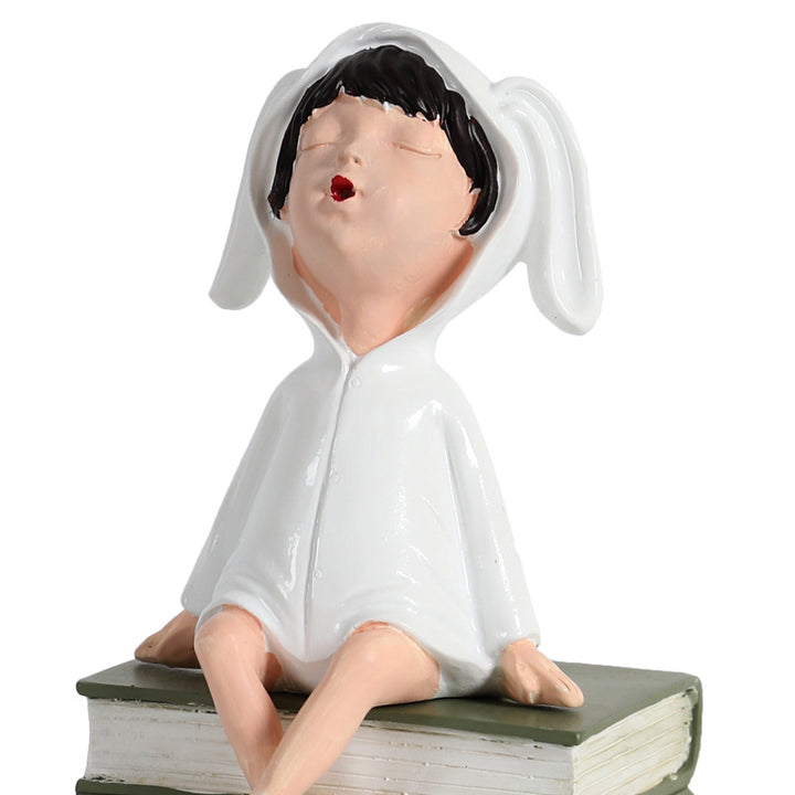 Playful Ceramic Book Figure