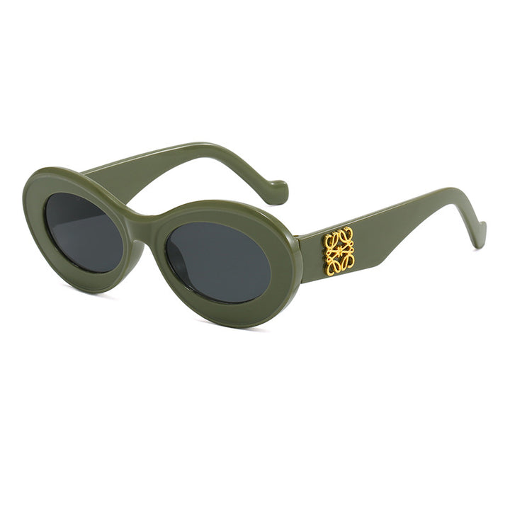 Women's fashionable sunglasses with oval frame and golden applications Kalsten