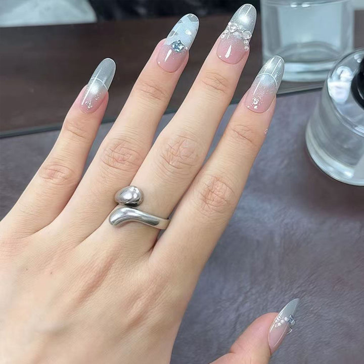 Artificial nail set with glamorous 3D details and radiant accents Kalsten
