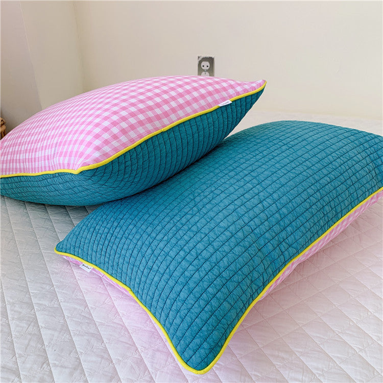 Reversible quilted pillow set with checked cotton cover and contrasting piping