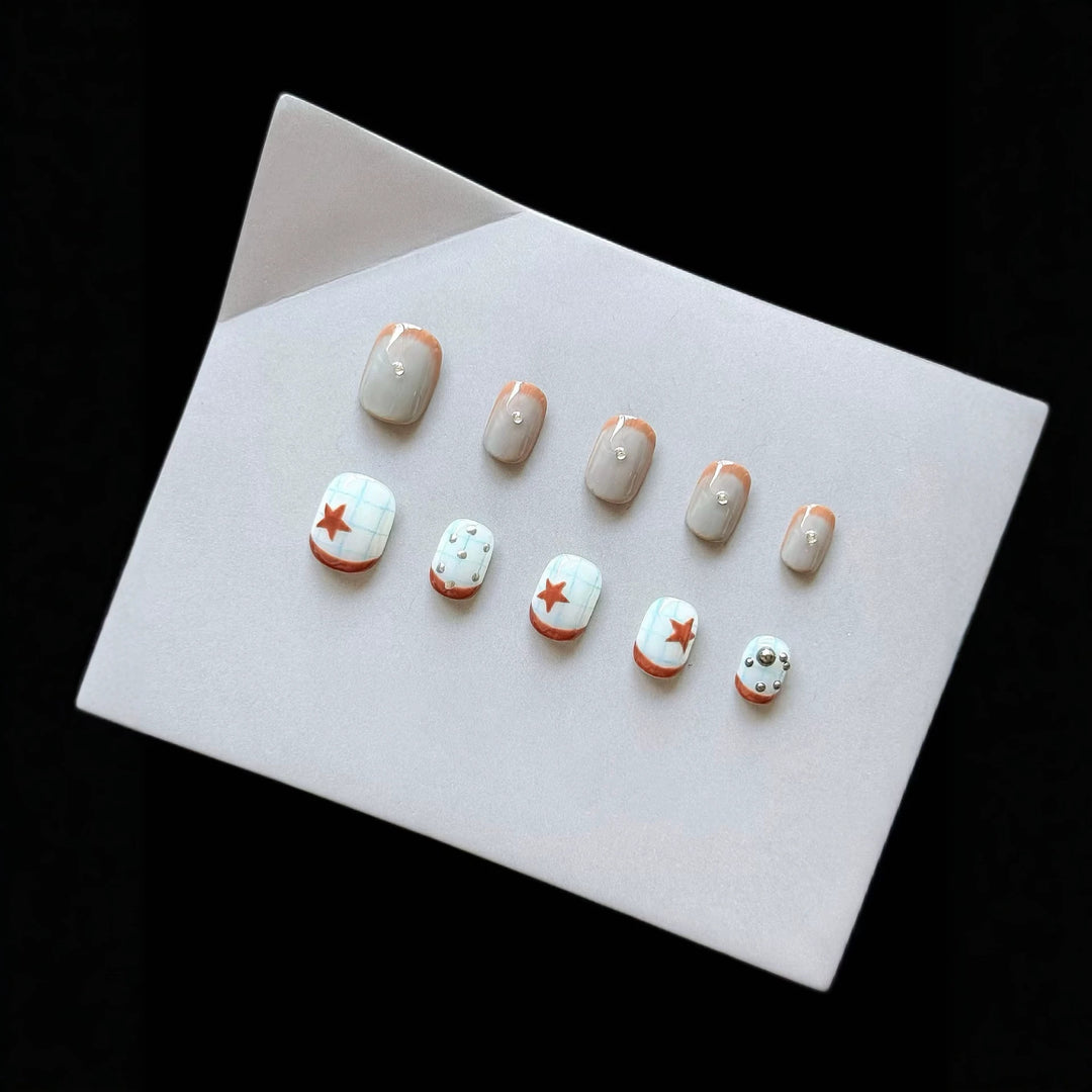 Artistic Press-On Nail Art Set with Star and Metallic Accents