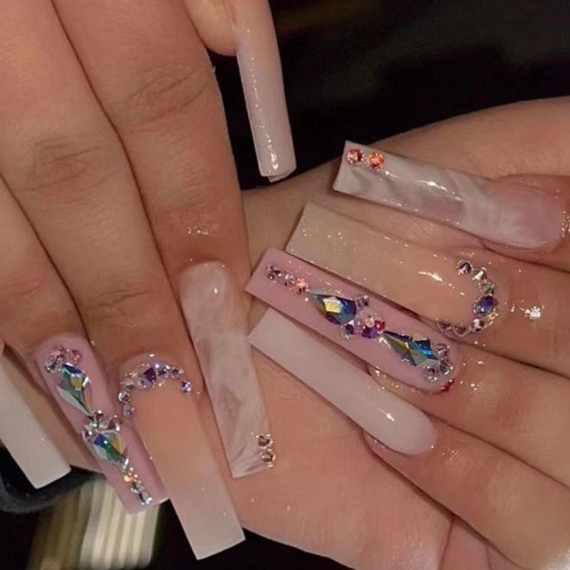 Glamorous artificial nails with gemstone embellishments Kalsten